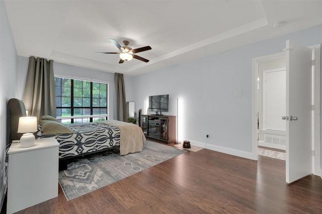 2434 Antler Trl, Lewisville, TX 75067 - bedroom with a raised ceiling, wood finished floors, baseboards, and a ceiling fan