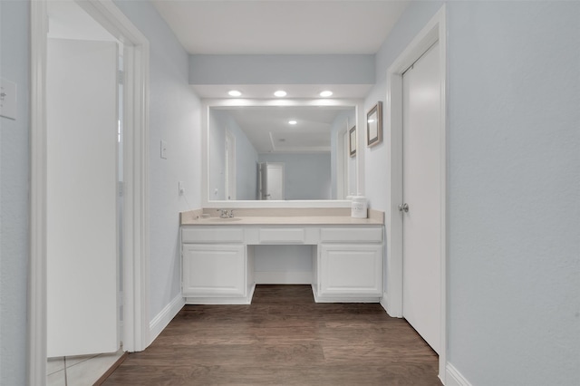 2434 Antler Trl, Lewisville, TX 75067 - bathroom featuring wood finished floors, vanity, baseboards, and recessed lighting