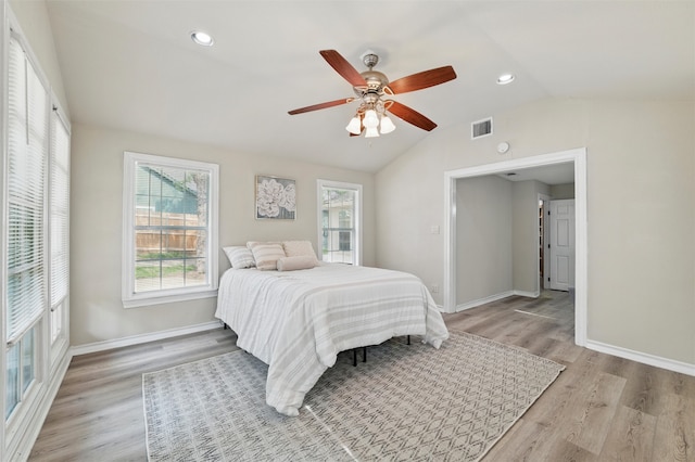 304 E Lee Ave, Weatherford, TX 76086 - bedroom featuring multiple windows, lofted ceiling, light wood-type flooring, baseboards, and recessed lighting
