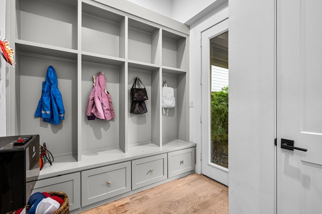 mudroom with light wood finished floors