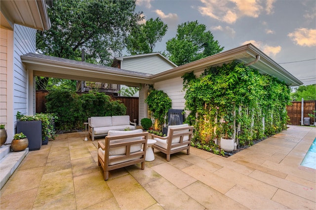 fenced backyard with an outdoor living space and a patio