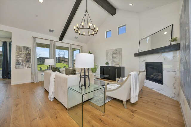 1208 Thornhill Ct, Roanoke, TX 76262 - living area with hardwood / wood-style flooring, a chandelier, beam ceiling, a high end fireplace, and high vaulted ceiling