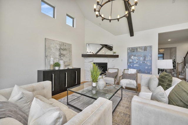 1208 Thornhill Ct, Roanoke, TX 76262 - living room featuring a chandelier, high vaulted ceiling, wood finished floors, and a premium fireplace