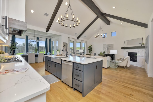 1208 Thornhill Ct, Roanoke, TX 76262 - kitchen with a chandelier, appliances with stainless steel finishes, open floor plan, gray cabinets, and a sink