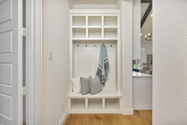1208 Thornhill Ct, Roanoke, TX 76262 - mudroom with wood finished floors, a chandelier, and baseboards