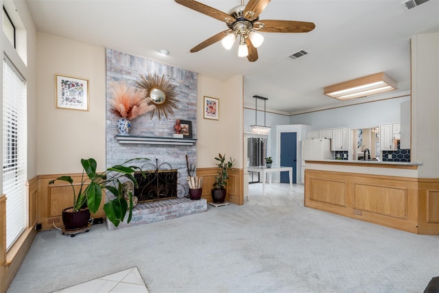 2203 Glen Helen Cir, Carrollton, TX 75007 - living area featuring light colored carpet, a fireplace, and a ceiling fan