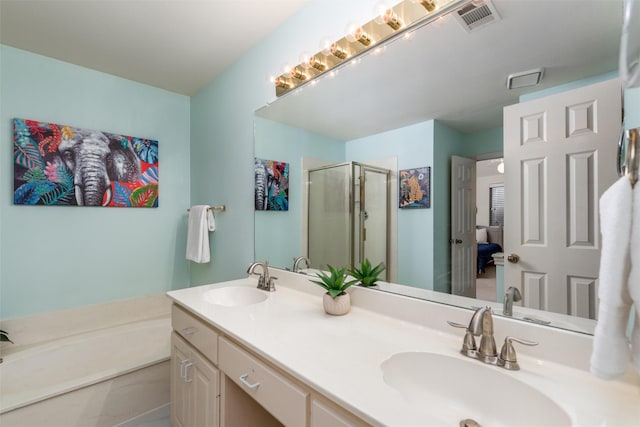 2203 Glen Helen Cir, Carrollton, TX 75007 - full bathroom featuring a stall shower, double vanity, and a bath
