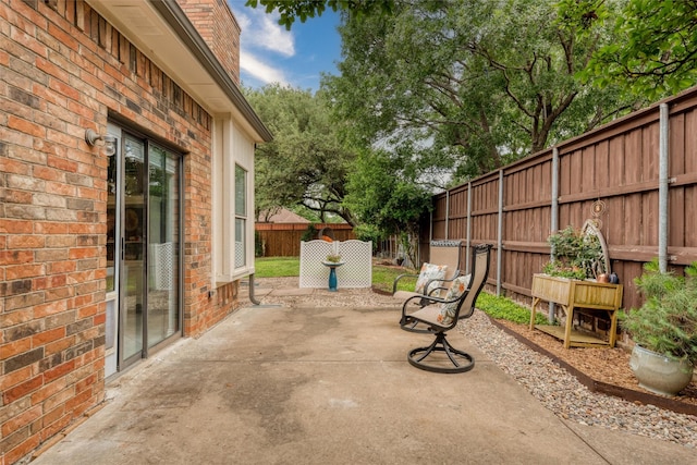 2203 Glen Helen Cir, Carrollton, TX 75007 - fenced backyard with a patio area