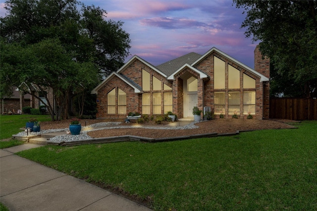 2203 Glen Helen Cir, Carrollton, TX 75007 - view of front of home with brick siding, a chimney, and a shingled roof