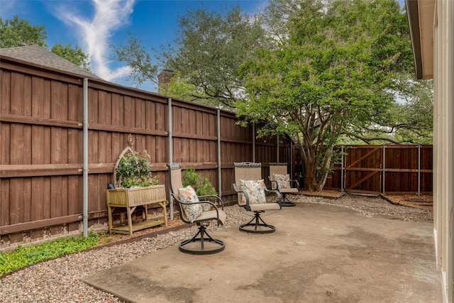 2203 Glen Helen Cir, Carrollton, TX 75007 - fenced backyard featuring a patio