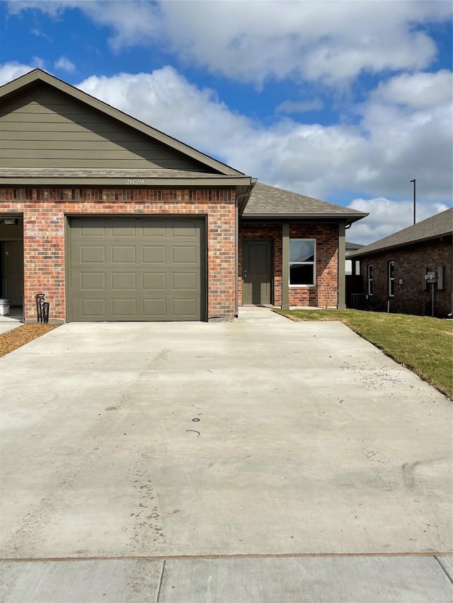 2829-2833 Peony Dr, Sherman, TX 75092 - single story home featuring driveway, a garage, and brick siding