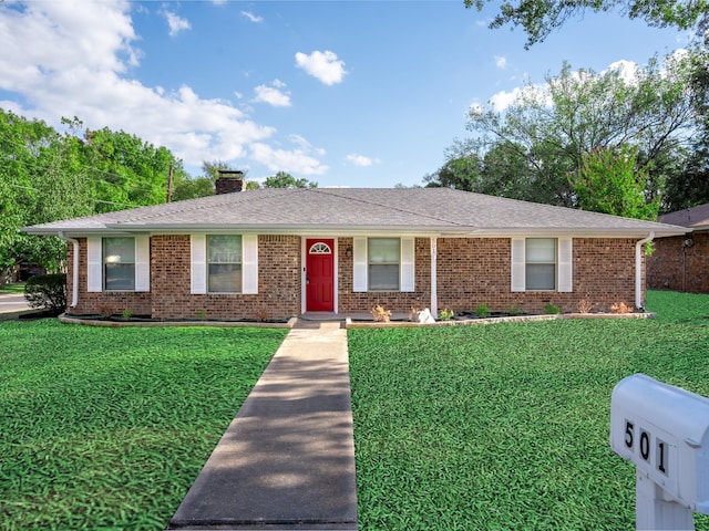 501 Edgewood Ave, Corsicana, TX 75110 - ranch-style house featuring a front yard, brick siding, and a chimney