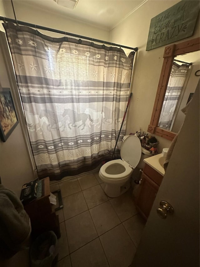6029 Graham St, Lake Worth, TX 76135 - full bathroom featuring tile patterned flooring, toilet, ornamental molding, vanity, and a shower with shower curtain