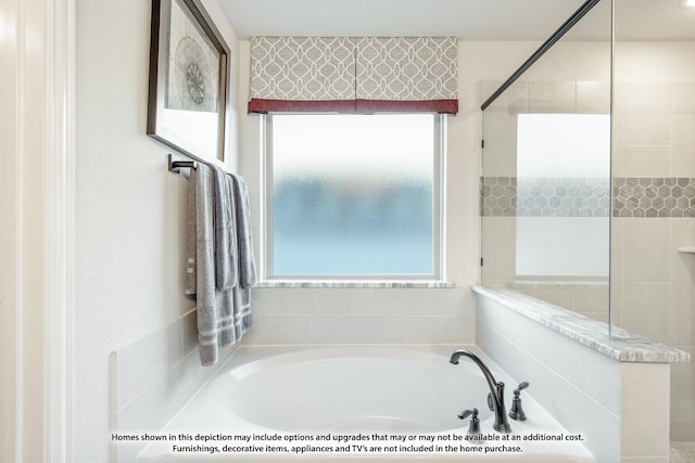 1200 Hawk St, Wylie, TX 75098 - bathroom with plenty of natural light, a garden tub, and a tile shower