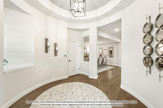 1200 Hawk St, Wylie, TX 75098 - foyer entrance with a chandelier, dark wood-style flooring, baseboards, and a high ceiling