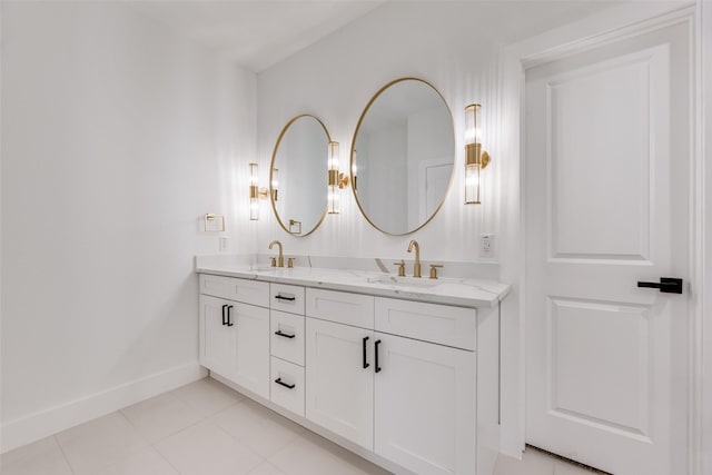 1008 Saint Matthew Cir, Royse City, TX 75189 - bathroom featuring baseboards, double vanity, and tile patterned floors