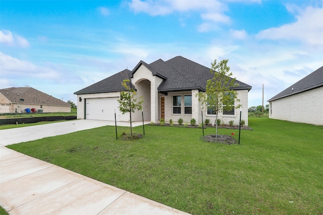 1008 Saint Matthew Cir, Royse City, TX 75189 - french country home featuring concrete driveway, brick siding, roof with shingles, an attached garage, and a front lawn