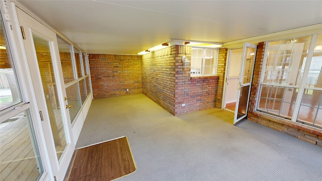 1913 Monte Cristo Way, Sherman, TX 75092 - unfurnished sunroom with brick wall and carpet