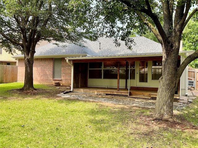 1913 Monte Cristo Way, Sherman, TX 75092 - rear view of house with a shingled roof and brick siding