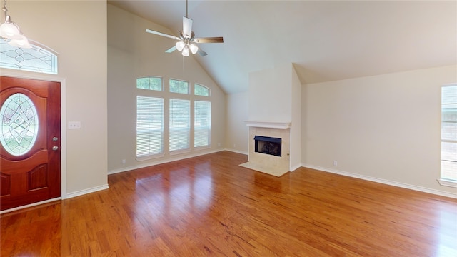 1913 Monte Cristo Way, Sherman, TX 75092 - unfurnished living room with plenty of natural light, wood finished floors, and high vaulted ceiling