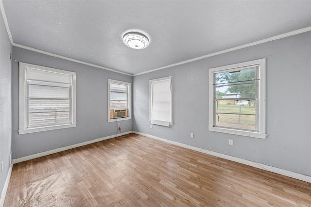 1677 Hobbs Ln, Waco, TX 76706 - spare room featuring plenty of natural light, ornamental molding, wood finished floors, and baseboards