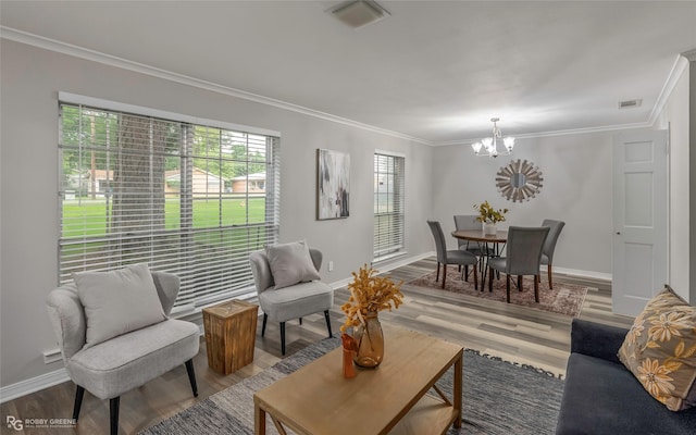 817 S Spruce St, Vivian, LA 71082 - living room with a chandelier, wood finished floors, ornamental molding, and baseboards