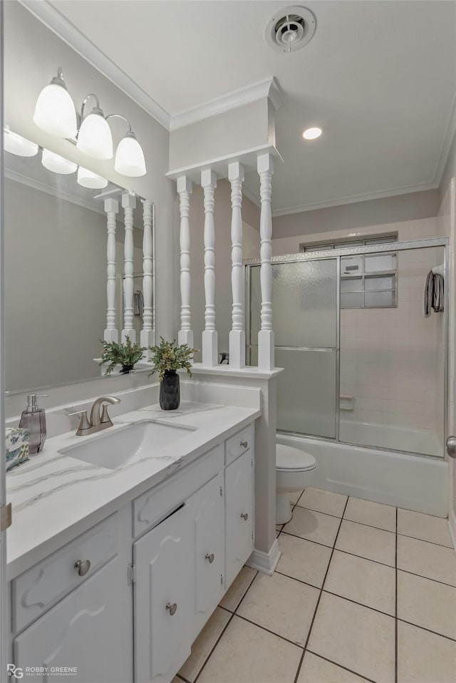 817 S Spruce St, Vivian, LA 71082 - bathroom featuring tile patterned flooring, crown molding, vanity, toilet, and combined bath / shower with glass door
