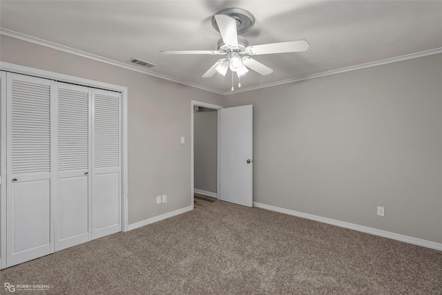 817 S Spruce St, Vivian, LA 71082 - unfurnished bedroom with carpet floors, a closet, ceiling fan, ornamental molding, and baseboards