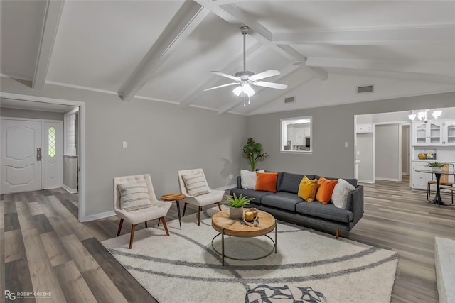 817 S Spruce St, Vivian, LA 71082 - living area featuring wood finished floors, baseboards, a chandelier, and a ceiling fan