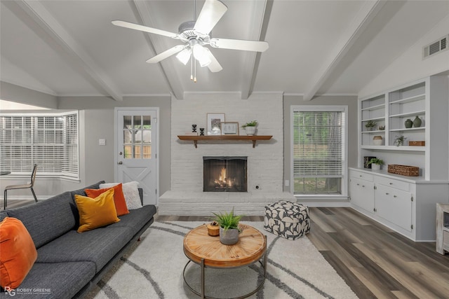 817 S Spruce St, Vivian, LA 71082 - living room with wood finished floors, a fireplace, and a ceiling fan