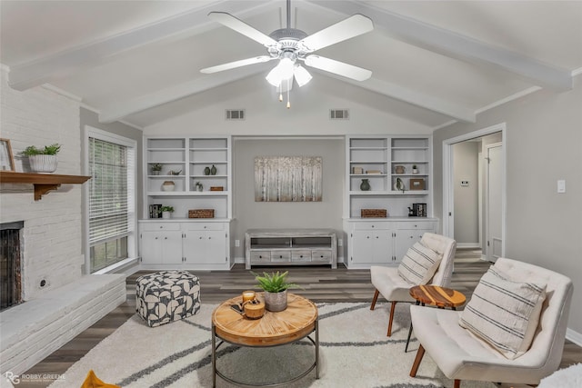 817 S Spruce St, Vivian, LA 71082 - living room featuring wood finished floors, a ceiling fan, a fireplace, and built in shelves