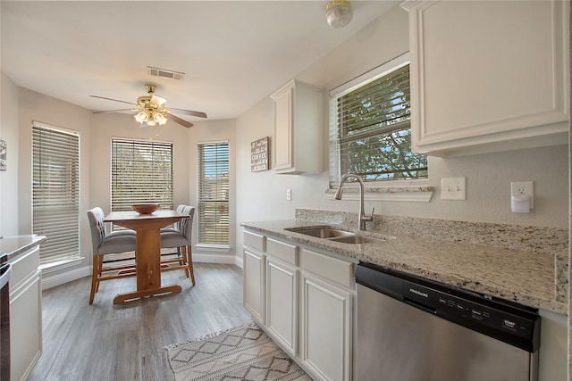 1034 Palomino Dr, Little Elm, TX 75068 - kitchen with dishwasher, a sink, a ceiling fan, light wood finished floors, and light stone countertops