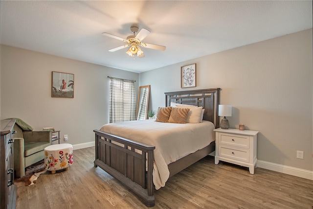 1034 Palomino Dr, Little Elm, TX 75068 - bedroom featuring baseboards, light wood-style flooring, and a ceiling fan