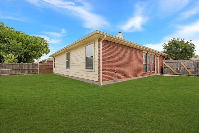 1034 Palomino Dr, Little Elm, TX 75068 - view of property exterior with a chimney and brick siding