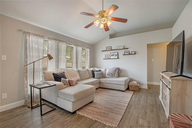 1034 Palomino Dr, Little Elm, TX 75068 - living room with lofted ceiling, ceiling fan, baseboards, and wood finished floors