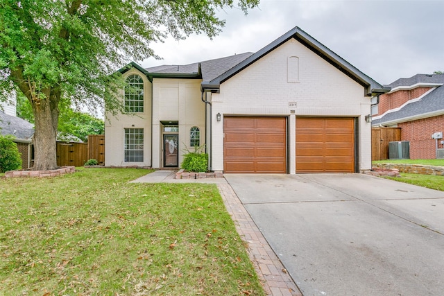 2317 Gatwick Ct, Flower Mound, TX 75028 - traditional-style house with a garage, driveway, and brick siding