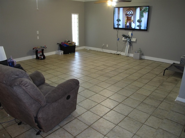 2406 14th Th, Brownwood, TX 76801 - living room featuring a ceiling fan, light tile patterned floors, and baseboards