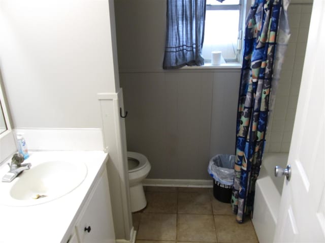 2406 14th Th, Brownwood, TX 76801 - full bathroom with toilet, tile patterned floors, vanity, and shower / tub combo