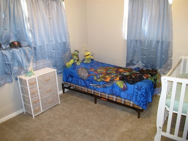 2406 14th Th, Brownwood, TX 76801 - bedroom with carpet floors and baseboards