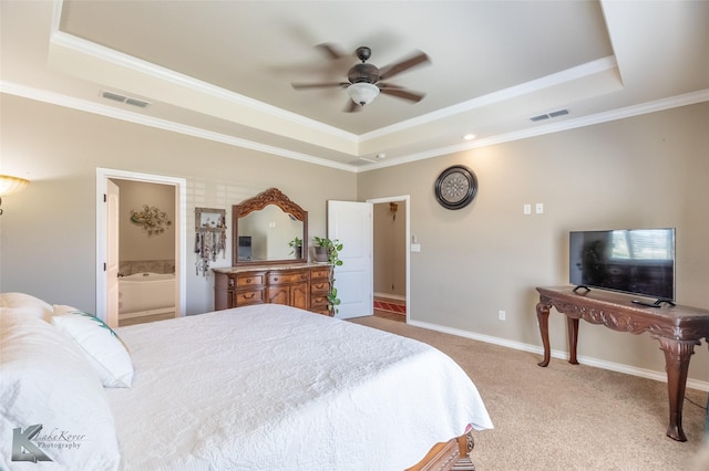 7201 Mcleod Dr, Abilene, TX 79602 - bedroom featuring a raised ceiling, ornamental molding, carpet, baseboards, and connected bathroom