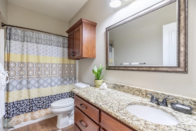 7201 Mcleod Dr, Abilene, TX 79602 - full bath featuring wood finished floors, toilet, vanity, and a shower with curtain