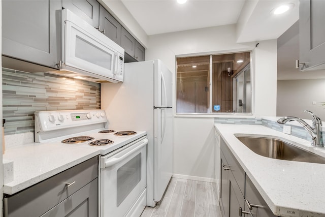 5130 Amesbury Dr Unit 103, Dallas, TX 75206 - kitchen with white appliances, gray cabinetry, a sink, tasteful backsplash, and recessed lighting