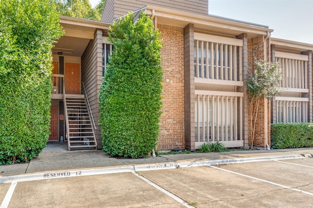 5130 Amesbury Dr Unit 103, Dallas, TX 75206 - view of property featuring uncovered parking and stairs