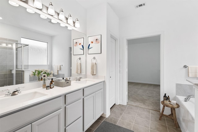 5405 Overbrook Dr, Denton, TX 76207 - full bath with a stall shower, double vanity, tile patterned floors, and a bath