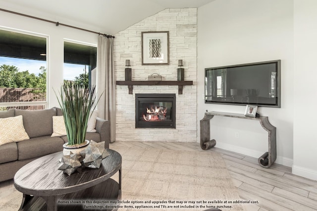 406 Maltese Cir, Wylie, TX 75098 - living area featuring lofted ceiling, a fireplace, baseboards, and wood finished floors