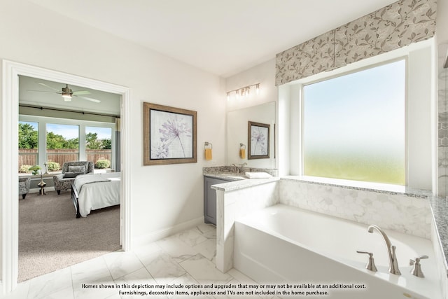406 Maltese Cir, Wylie, TX 75098 - bathroom featuring baseboards, ensuite bath, vanity, a garden tub, and marble finish flooring