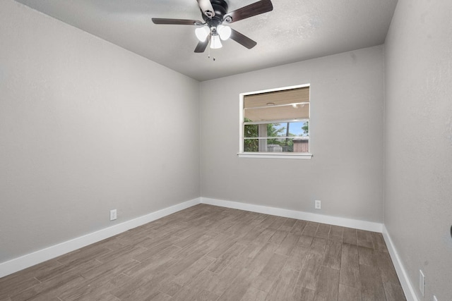 6012 Whispering Ln, Watauga, TX 76148 - spare room featuring wood finished floors, ceiling fan, and baseboards
