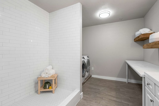 6012 Whispering Ln, Watauga, TX 76148 - washroom featuring separate washer and dryer, dark wood-type flooring, and baseboards