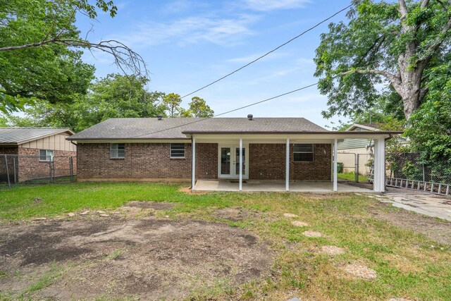 6012 Whispering Ln, Watauga, TX 76148 - rear view of property with brick siding, a patio, french doors, and roof with shingles