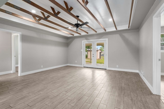 6012 Whispering Ln, Watauga, TX 76148 - unfurnished living room with wood finished floors, a ceiling fan, french doors, beam ceiling, and baseboards